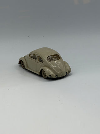 Light gray LEGO VW Beetle model car in HO scale, shown from a three-quarter angle with visible windows and wheels.