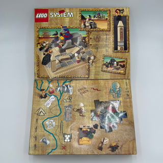 LEGO Adventurers set 5978 box showing sphinx structure with minifigures, accessories, and adventure-themed baseplate insert.