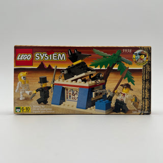 LEGO System Adventurers set 5938 box showing desert scene with skeleton, minifigures, palm trees, and black aircraft structur