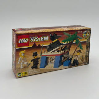 LEGO System box 5938 with desert oasis scene, palm trees, skeletal figures, and minifigures on sandy base.