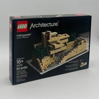 LEGO Architecture set 21005 of Fallingwater house with tan and brown bricks on display base with surrounding trees.