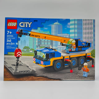 LEGO City mobile crane set 60324 with blue and orange crane truck, minifigures, and urban backdrop on box.