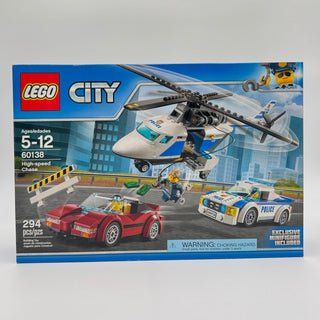 LEGO City High-speed Chase set 60138 box showing police helicopter, red sports car, white police car, and minifigures.