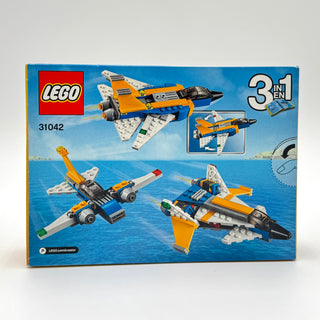 LEGO Creator 31042 box showing three aircraft variants built from orange, white, and black pieces against blue sky background