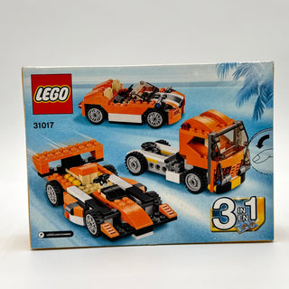 LEGO Creator set 31017 box showing three orange and white buildable vehicles: a convertible car, race car, and truck.