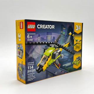 LEGO Creator 31092 Helicopter Adventure set box showing yellow and black helicopter with rotor blades and cityscape backgroun