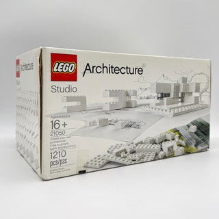 LEGO Architecture Studio set 21050 box showing product contents and building instructions on cream-colored packaging.
