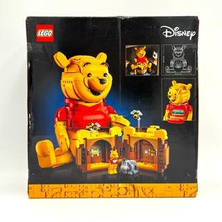 LEGO Disney Winnie the Pooh set box featuring large yellow and red bear figure with buildable house structure and accessories
