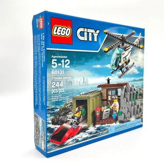 LEGO City Crooks Island set 60131 box featuring helicopter, island hideout, speedboat, and minifigures.