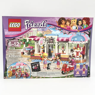 LEGO Friends Heartlake Cupcake Café set 41119 box showing pink and white café building with minifigures and accessories.