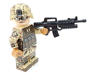 Tan camouflage minifigure in military gear holding black M16A2 rifle with grenade launcher attachment.