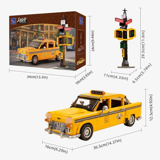 Yellow taxi cab model with checkered stripe, roof light, and accompanying traffic signal accessory.