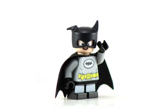 Black and gray minifigure with pointed ear cowl, mask, cape, and chest emblem with yellow belt detail.