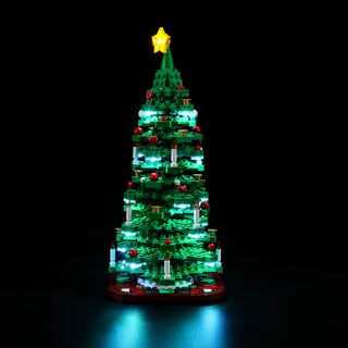 Green LEGO Christmas tree with cyan and white LED lights, red ornaments, and yellow star topper.